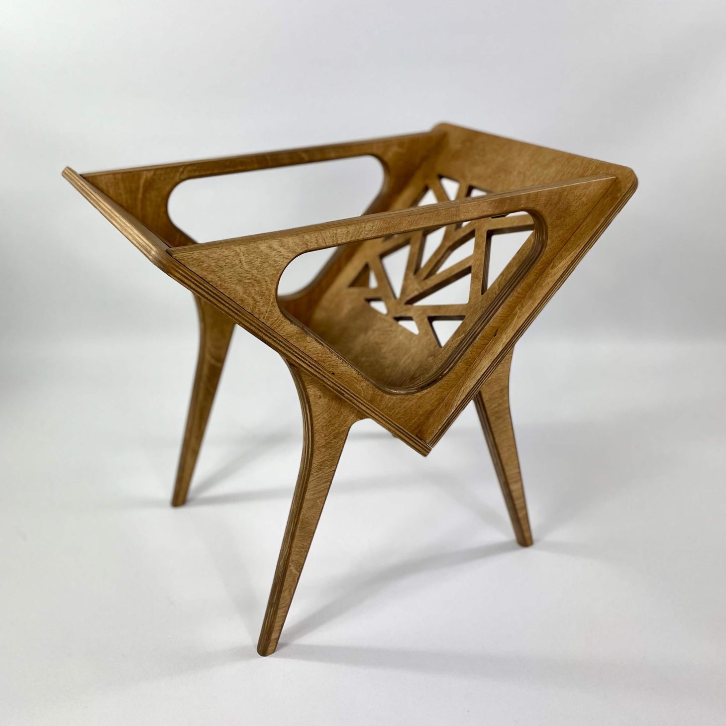 Minimalist vinyl stand in warm walnut finish displayed without records