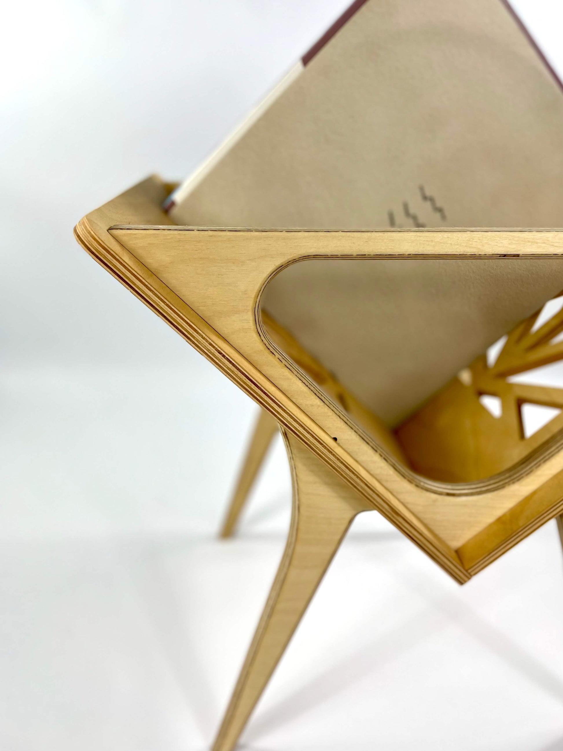 Front view of Small Thor vinyl stand emphasizing its triangular shape and leg design