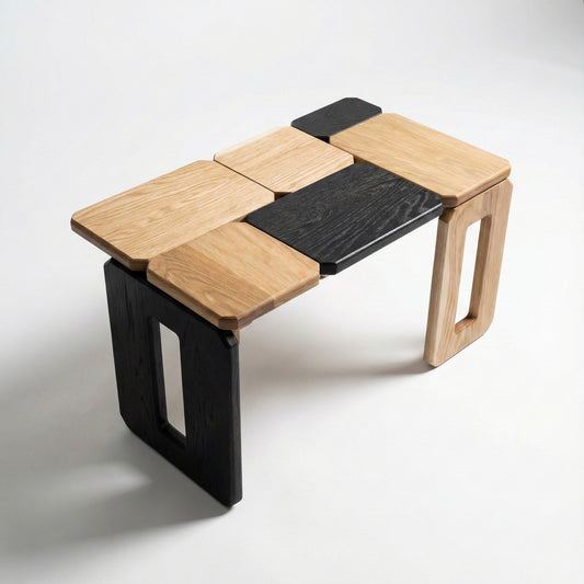 Modular wooden coffee table with black and natural wood panels on a white background