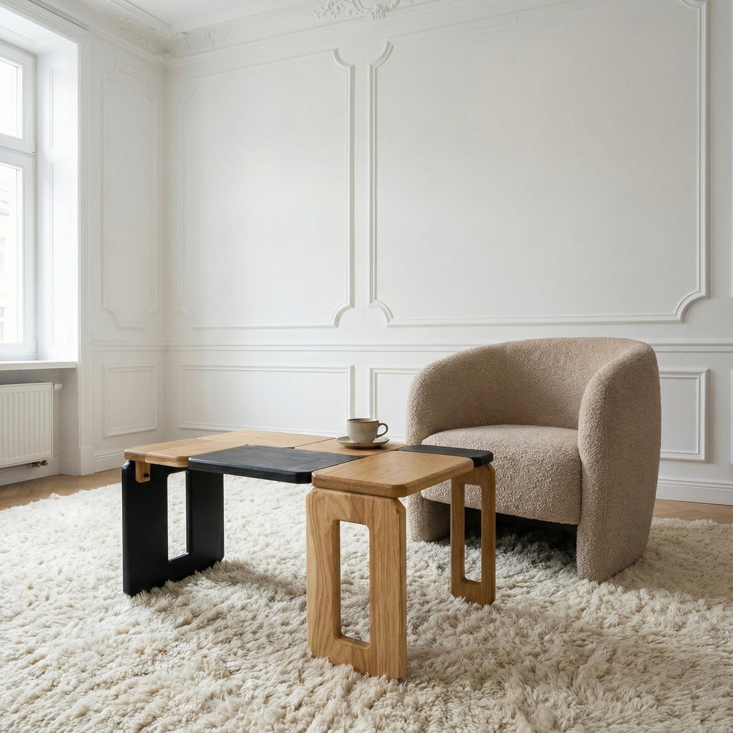 Modern living room with a beige armchair and wooden coffee table.