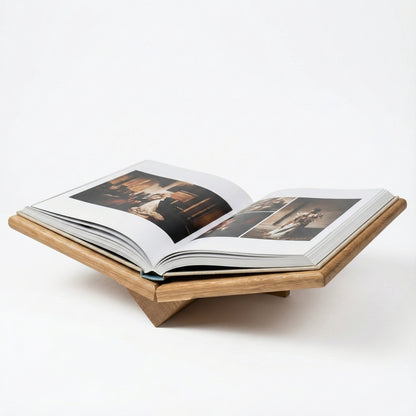 Open book on a wooden stand with images inside, on a white background