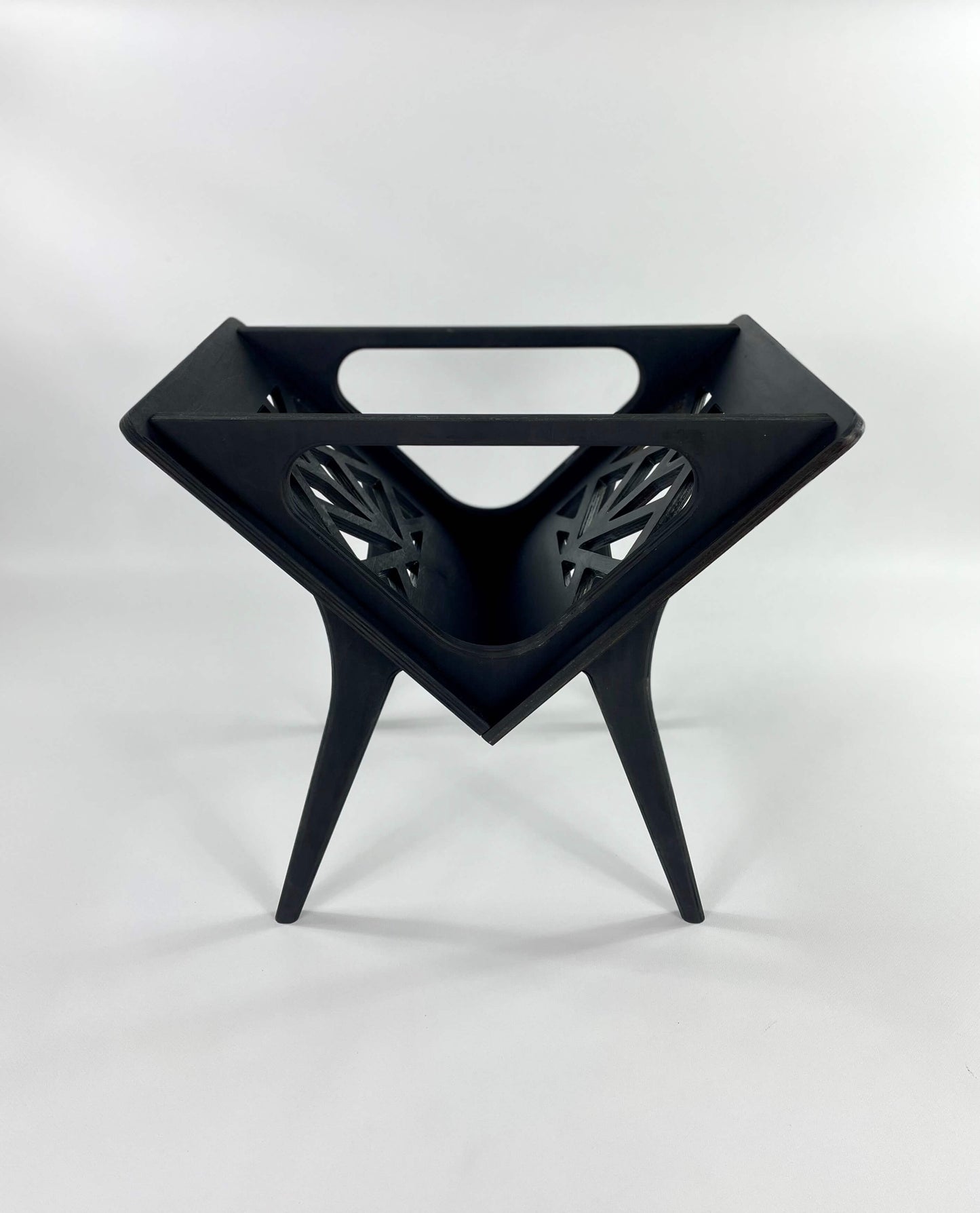Black vinyl stand, showcasing minimalist style and unique design