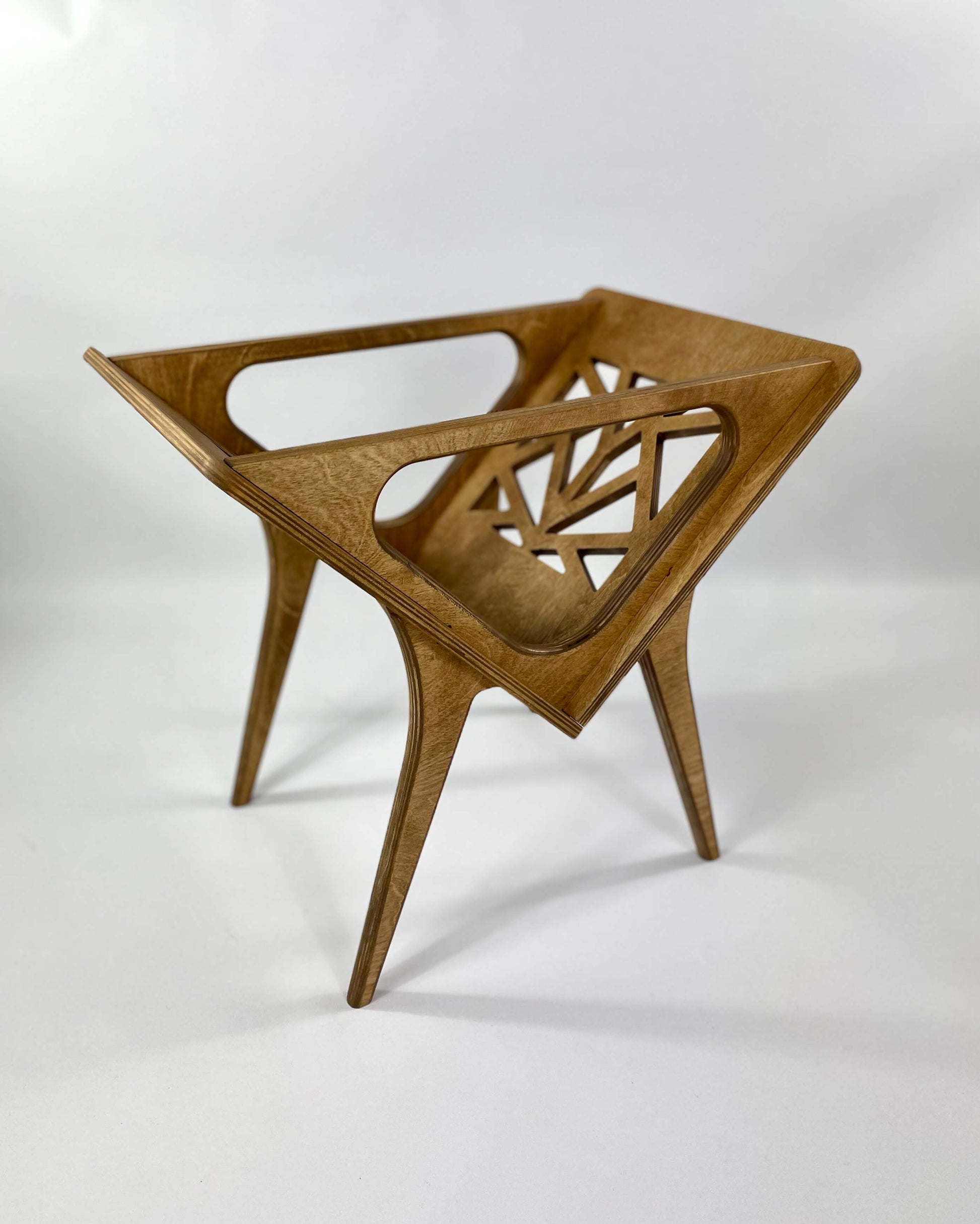 Minimalist vinyl stand in warm walnut finish displayed without records