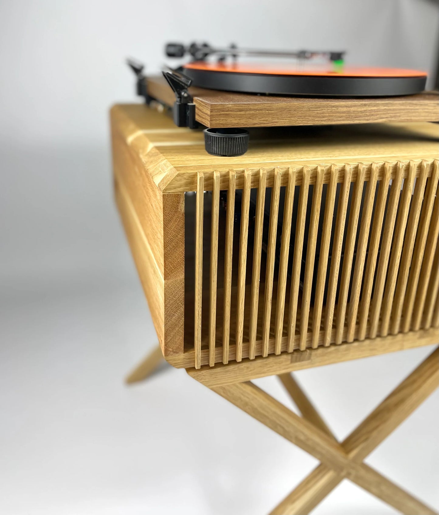Wooden record player with a white background