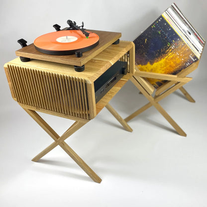 Wooden record player with vinyl record on a white background