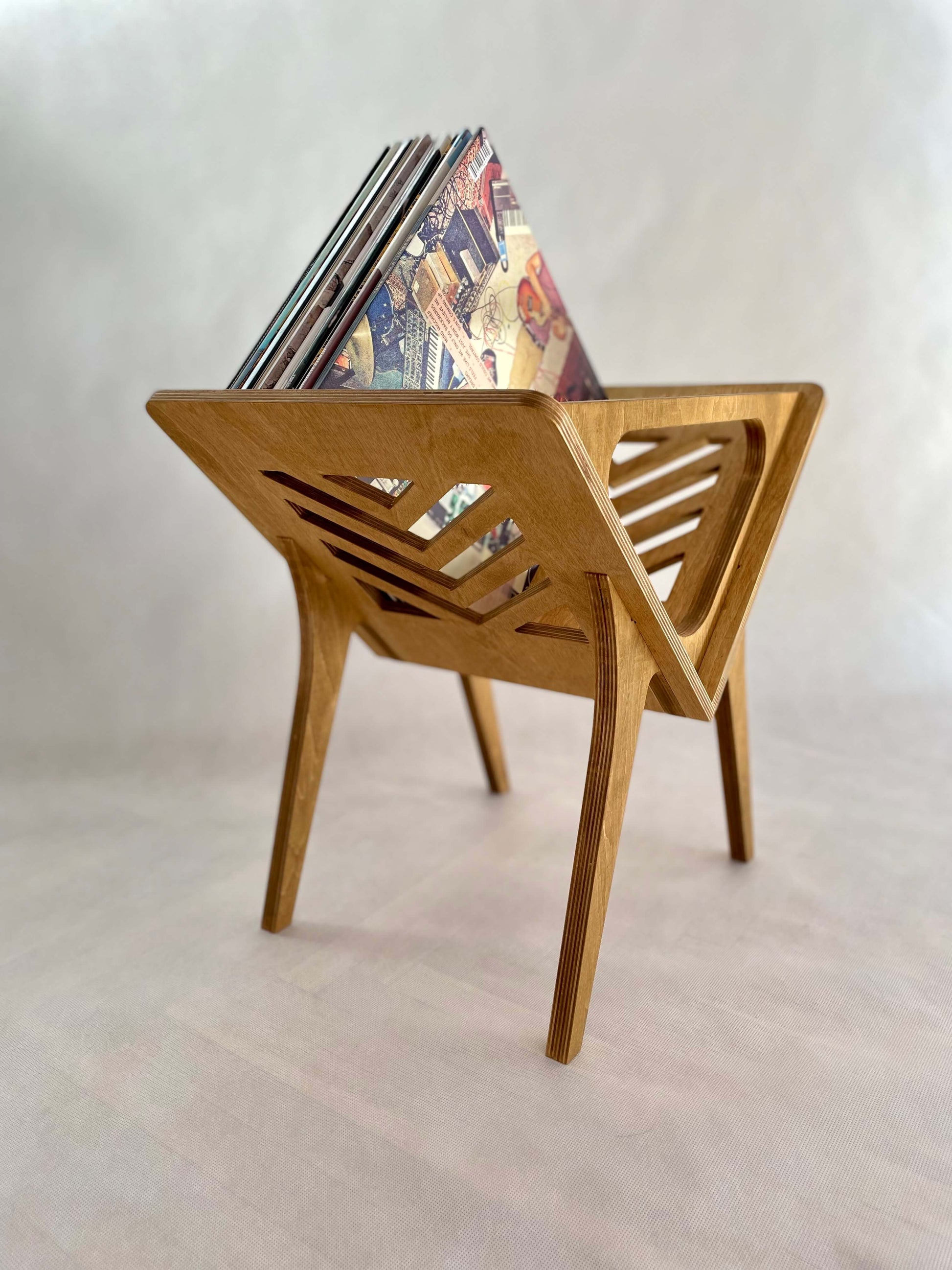 Side angle showcasing the herringbone pattern on Thor Vinyl Stand in honey oak finish