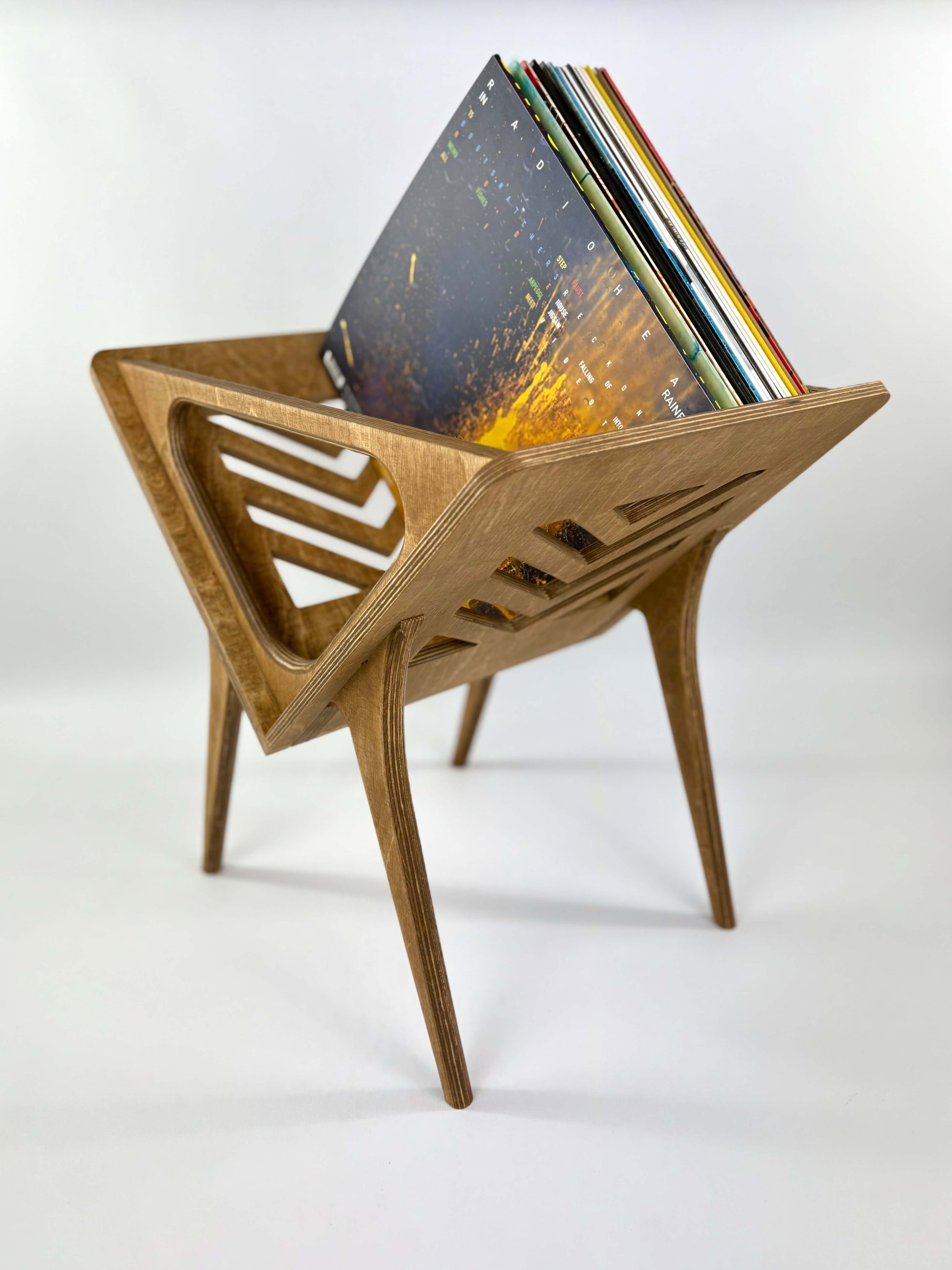 Vinyl stand displaying records in walnut finish