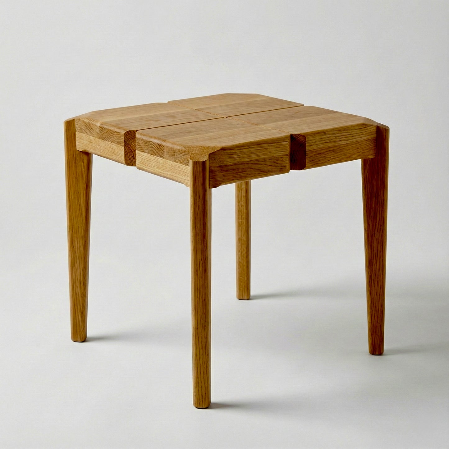 Wooden side table or a stool on a white background